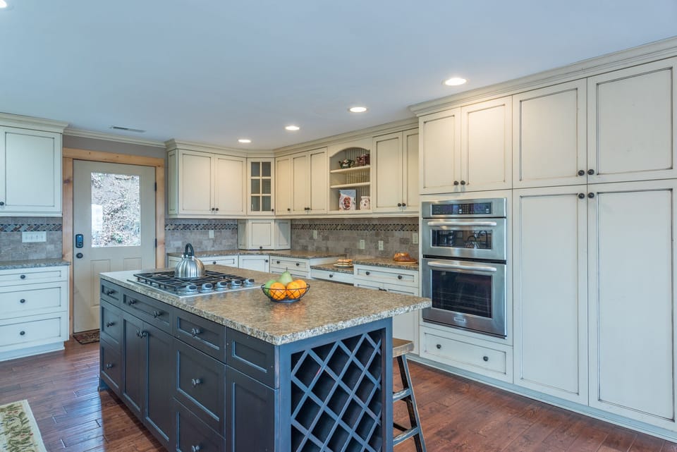 Large kitchen with double oven, pantry, oversized copper farm sink, five-burner propane gas stove, and 2 types of coffeemakers (Standard Drip & Keurig)