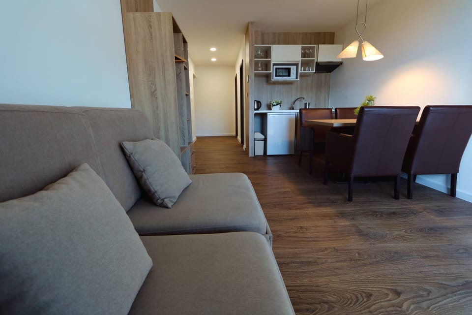 Premium Apartment, Balcony, Partial Lake View | In-room dining