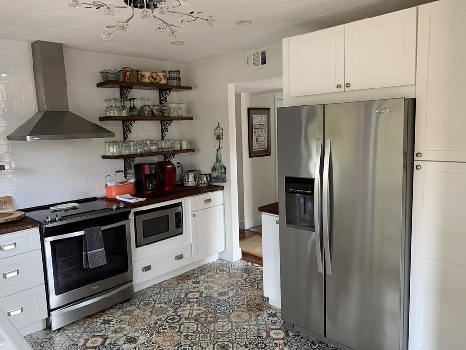 Entry to fully stocked kitchen from the dining area

