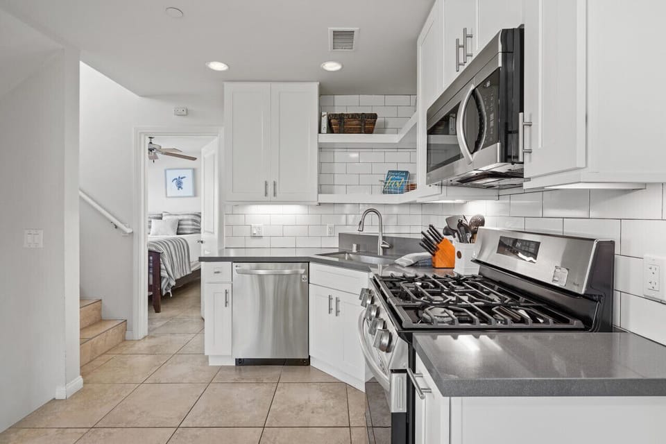 A 2021 renovated kitchen creates an open concept living area.