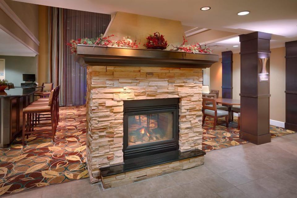 Relax by the elegant stone fireplace, adding a touch of charm to this inviting space.