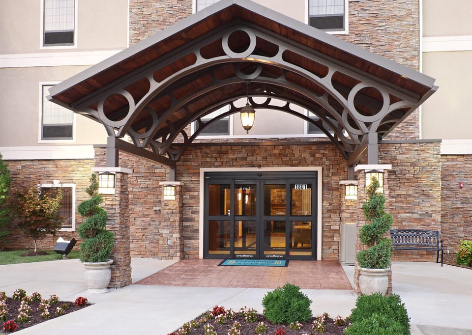 Step through our elegant stone entrance — comfort and hospitality start right here.