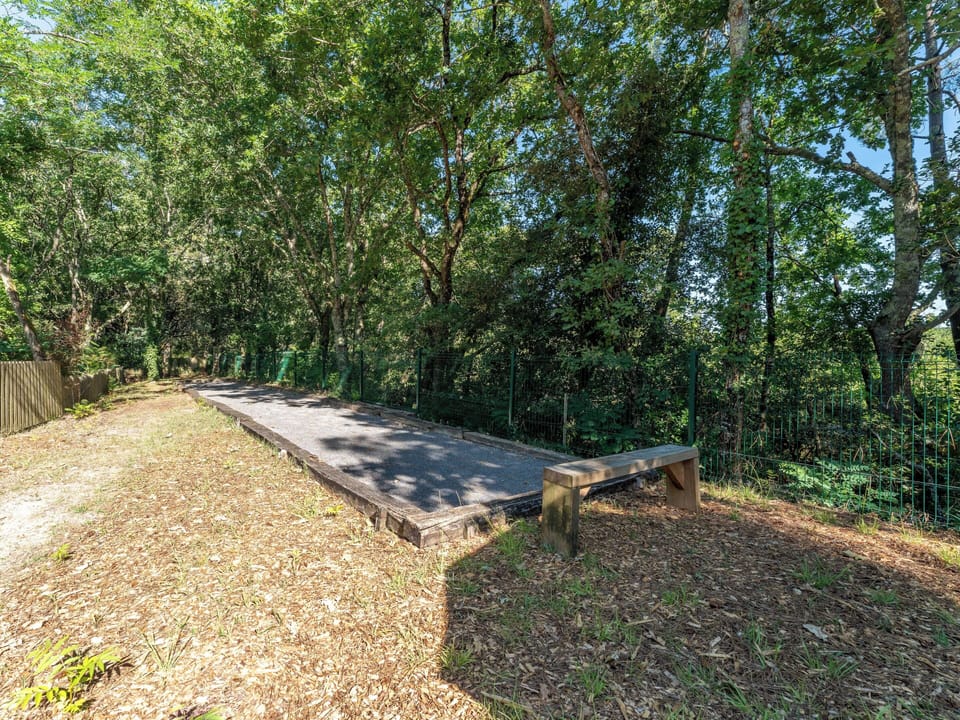 The residence pétanque court, tucked into the pine forest — a classic French tradition just steps from your apartment.