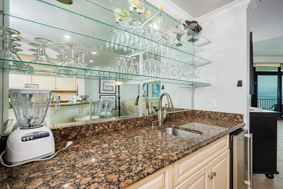 Blend smoothies at the wet bar, chill drinks in the stainless fridge, or grab snacks for the beach