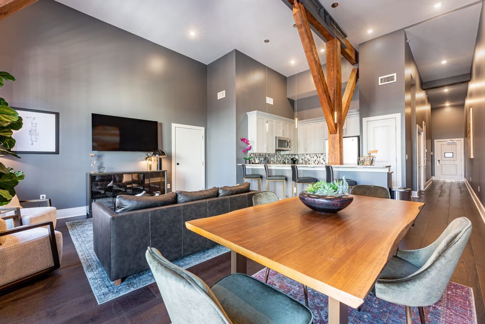 Open concept living, kitchen, and dining area with comfortable seating for you and your guests. 65” Samsung Smart 4K TV for streaming apps and DIRECTV. Sofa converts to a queen-size sleeper. Dining table for four. Lots of natural light!