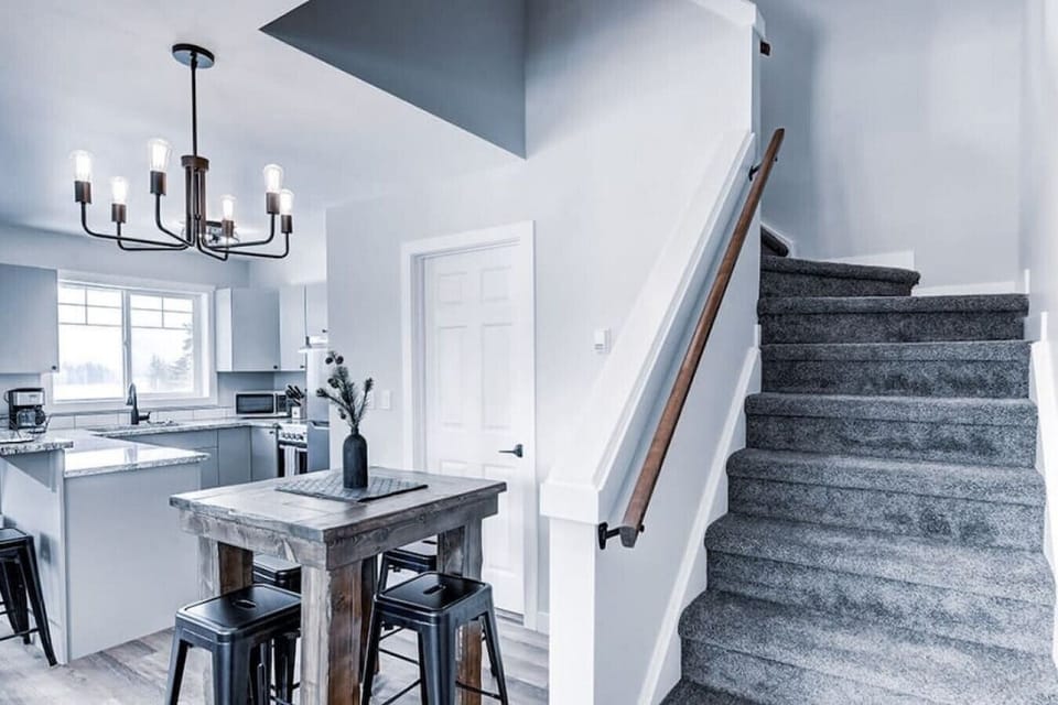 The dining area and staircase to the upper floor.