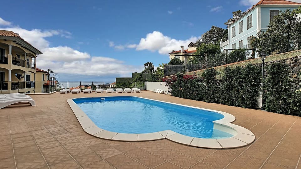 Outdoor community pool #oceanview #pool #bluesky #sunbathing