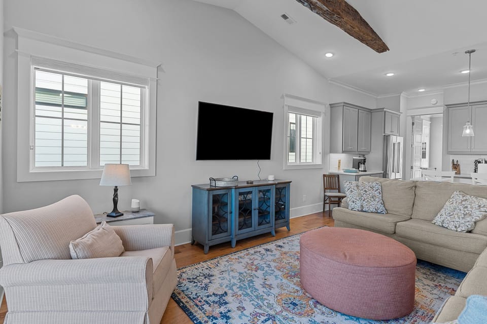 Bright, open concept living area with Smart TV.