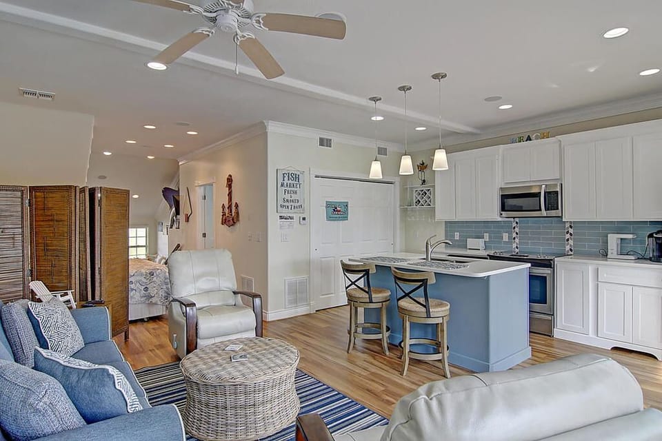 Unwind in your bright, coastal-inspired space where nautical touches and modern comforts create the perfect beach retreat.