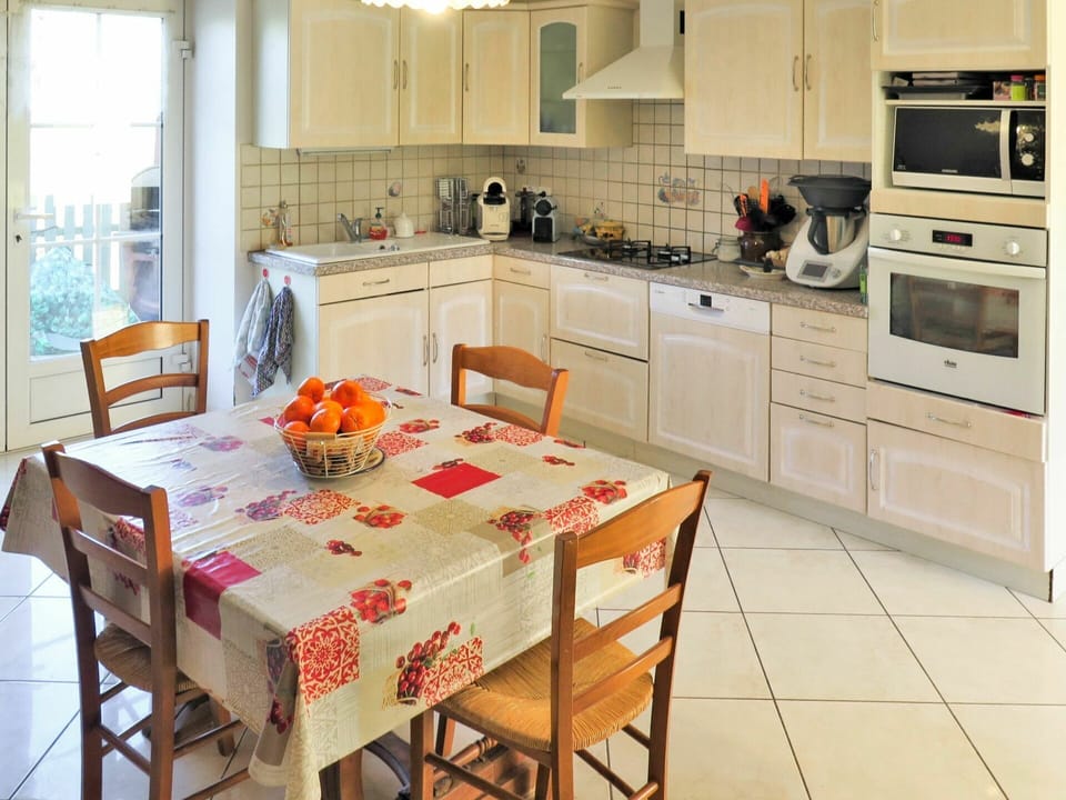Furniture, Cabinetry, Property, Countertop, Table, Window, Kitchen Appliance, Gas Stove, Chair, Kitchen Stove