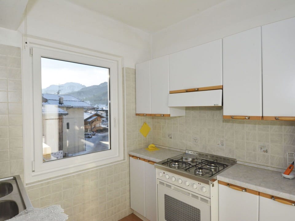 Cabinetry, Building, Countertop, Kitchen Stove, Cooktop, Kitchen Appliance, Kitchen, Gas Stove, Wood, Interior Design