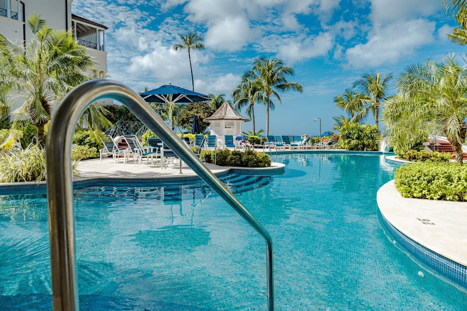 The pool looks directly onto the beach and ocean - lots of sun loungers and umbrellas available