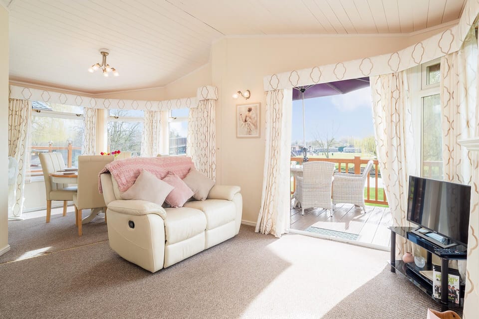 Luxurious leather sofas and beautiful decking with river views.
