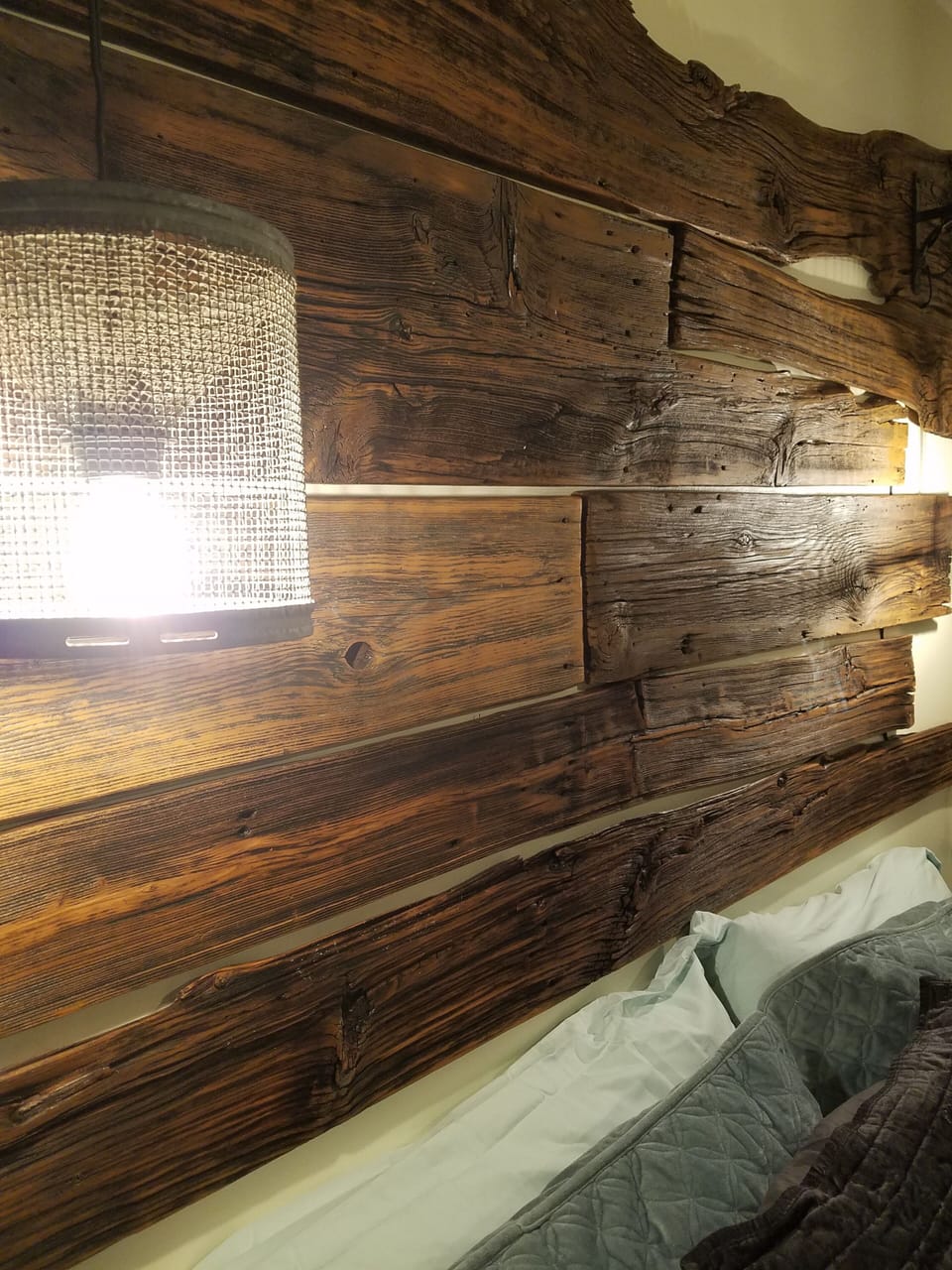 The lights are from a refurbished minnow trap. 140 year old barn boards