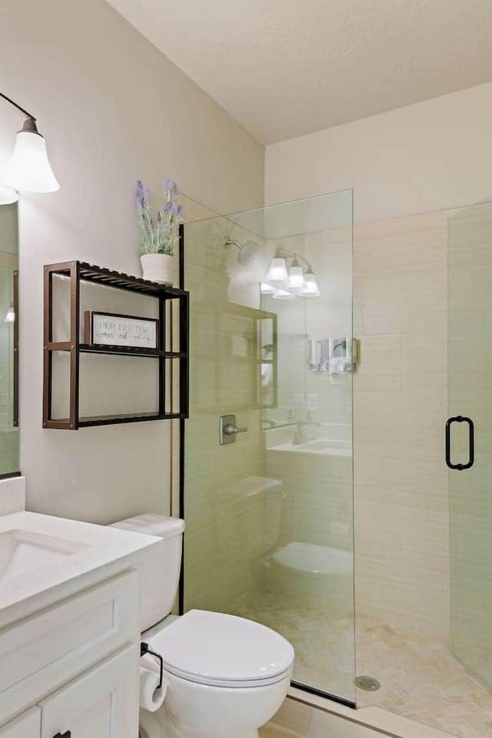 Main floor full bath off the entry hall and Queen Suite.  We LOVE the glass door showers with beautiful tile and have included Shampoo/Conditioner/Body Wash dispensers in each!  ENJOY!