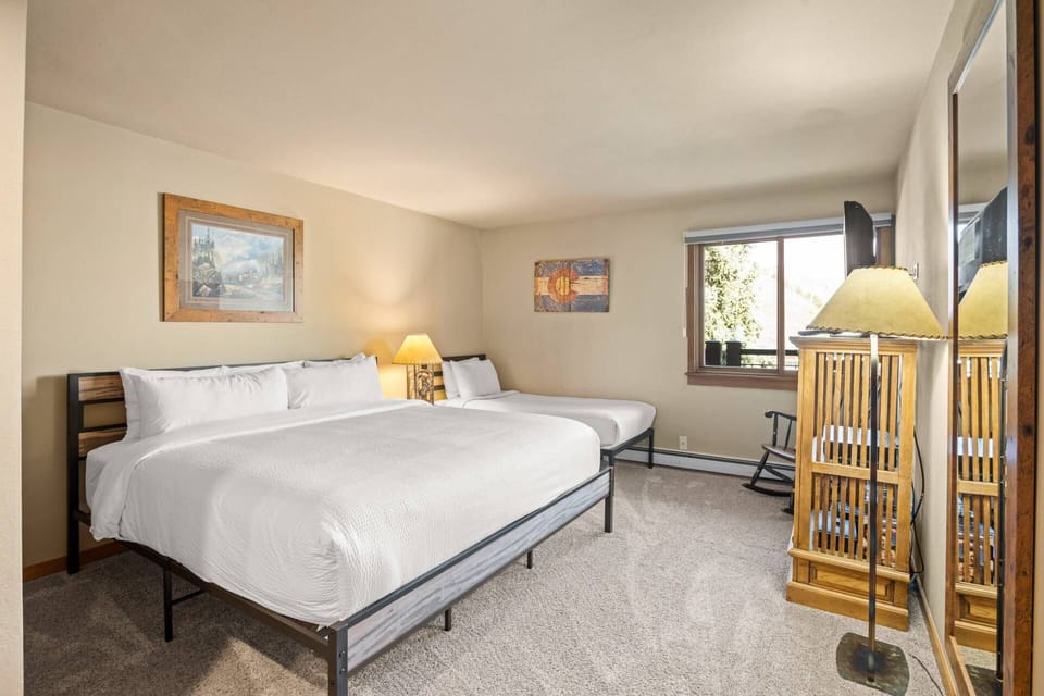 The second bedroom offers a queen bed, twin bed and a trundle bed, a flat screen TV and en-suite bath.