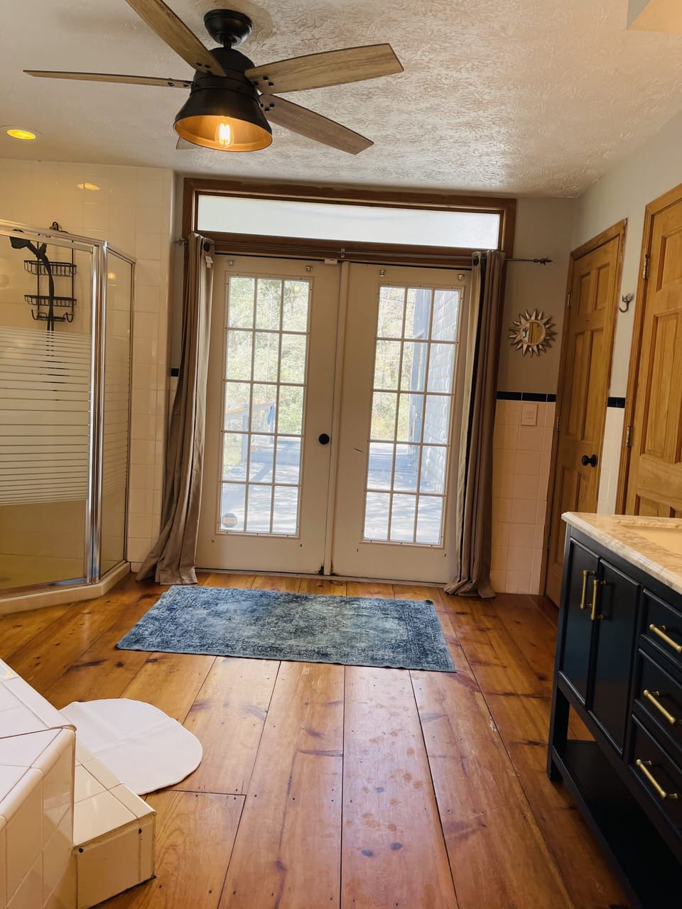 Master Bathroom with double vanity, tub & standup shower with access to porch