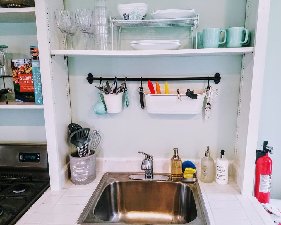 Large kitchen sink. Dishware/flatware for 4. 