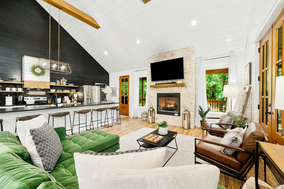 Floor to ceiling shiplap and exposed wood beams welcome you in this cabin.
