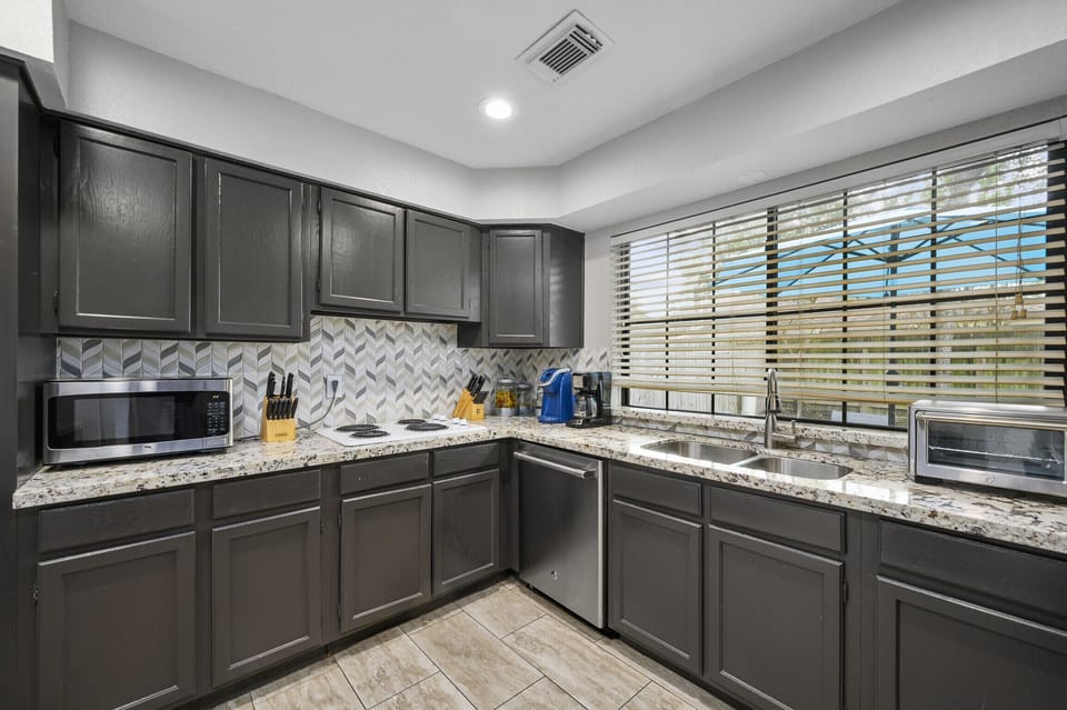 Huge, open kitchen. Double Ovens. Great view of the back patio!