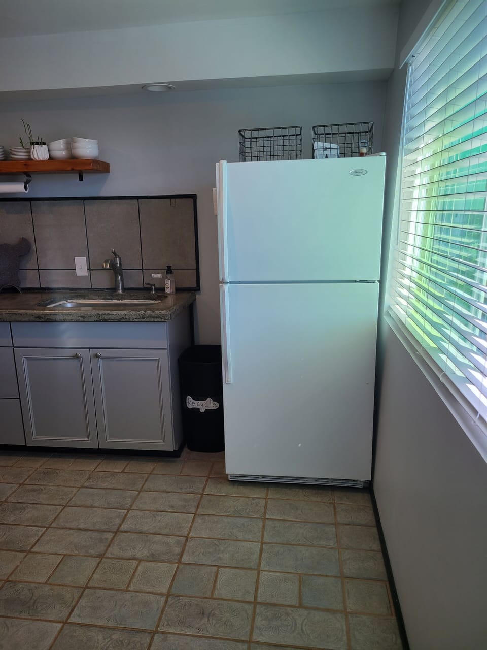apartment size refrigerator in kitchenette 