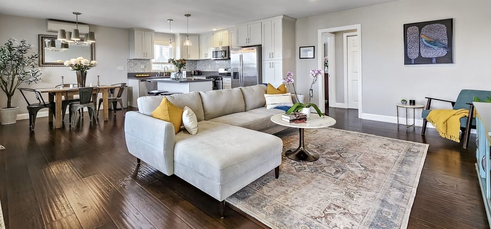 Open living room and dining room concept. Plus a mini split air conditioner to keep you warm or cool.