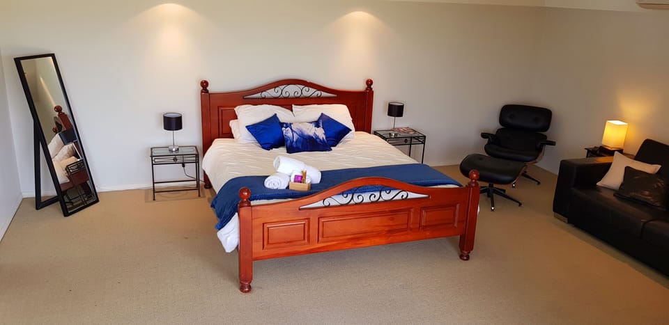 Downstairs king room with queen sofa bed, walk in robe and portico...