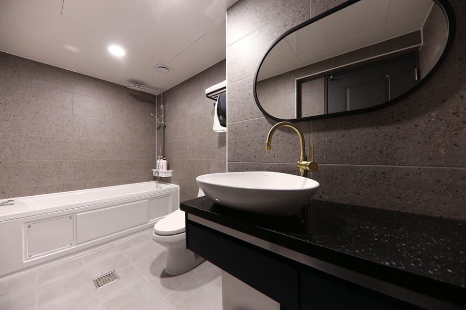 Shower, rainfall showerhead, designer toiletries, hair dryer