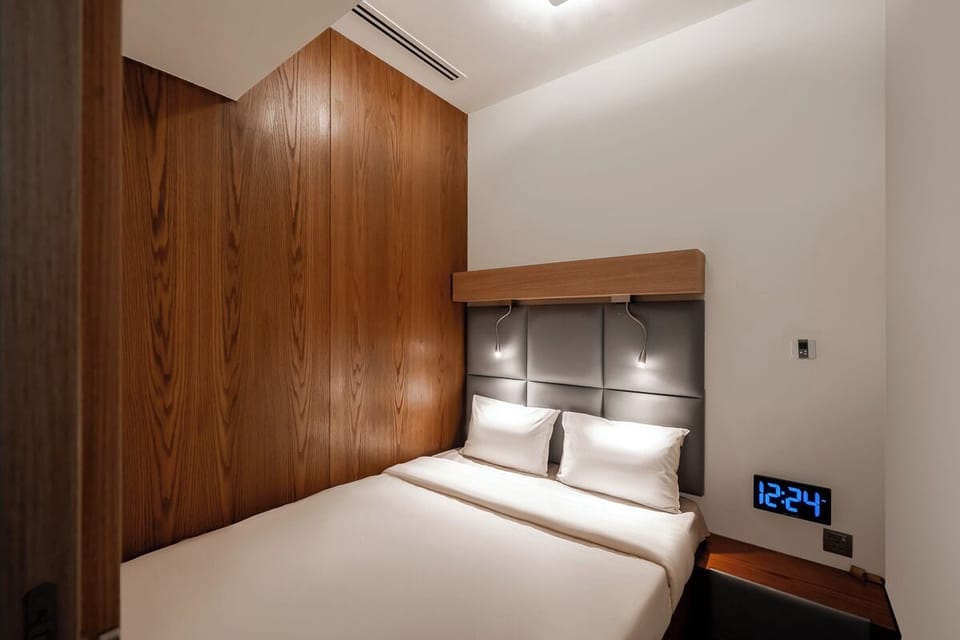 Laptop workspace, bed sheets