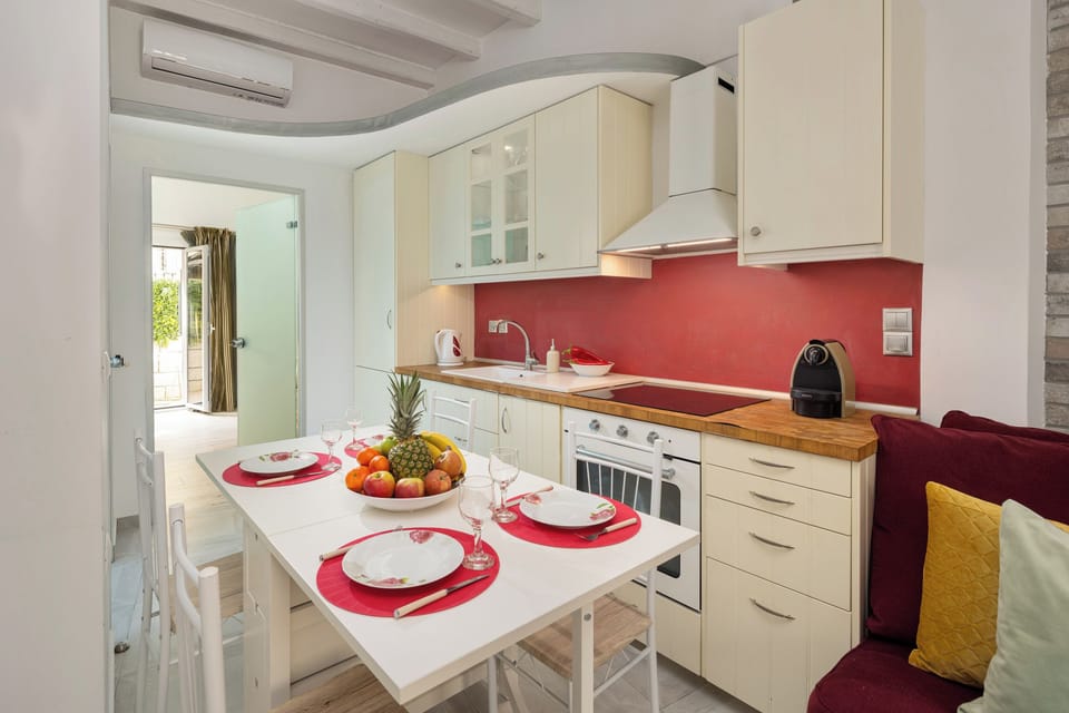 Design Apartment, 1 Bedroom, Garden View, Ground Floor | Living area | Flat-screen TV