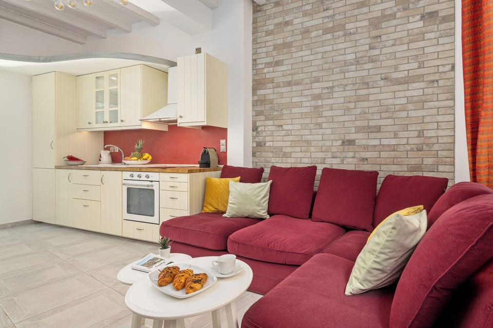 Design Apartment, 1 Bedroom, Garden View, Ground Floor | Living area | Flat-screen TV