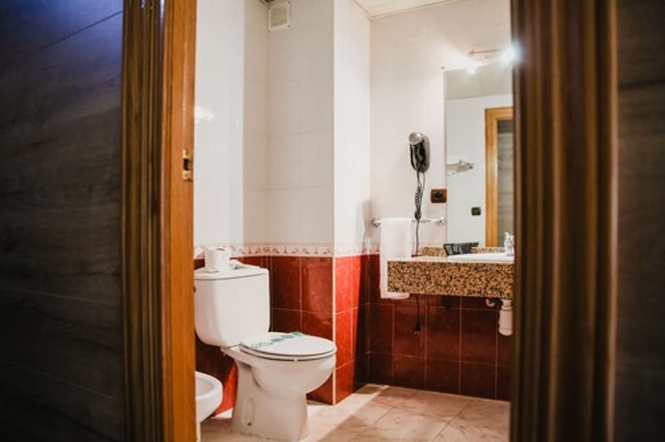Combined shower/tub, deep soaking tub, hair dryer, bidet