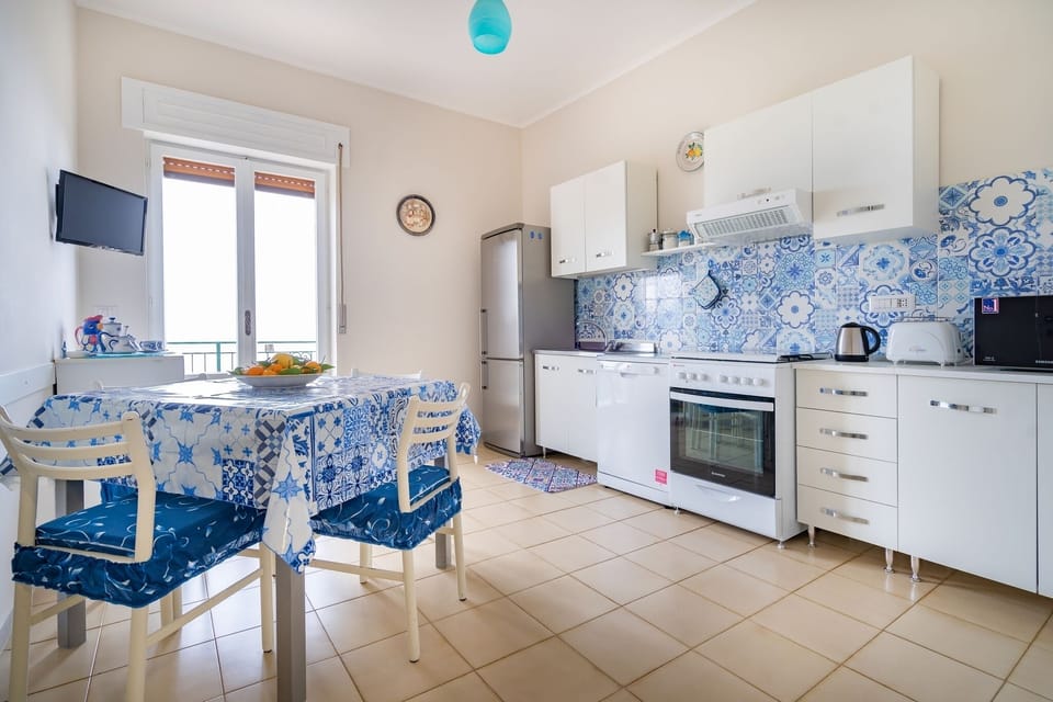 Apartment, 2 Bedrooms, Patio, Sea View | Private kitchen | Full-size fridge, microwave, oven, stovetop