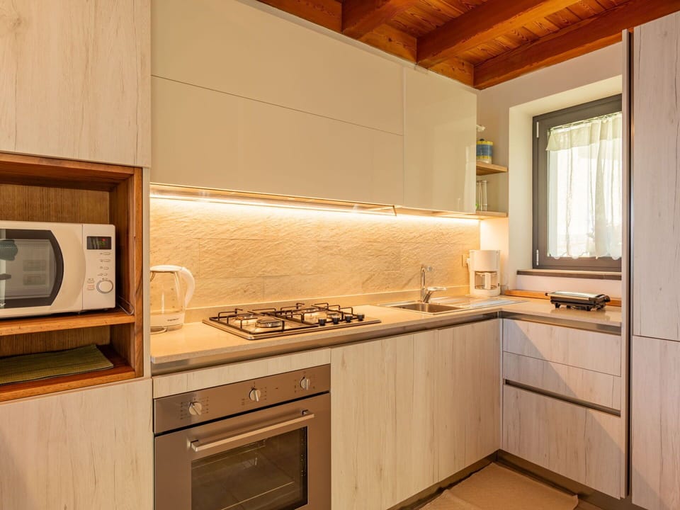 Cabinetry, Countertop, Property, Building, Kitchen Appliance, Kitchen Stove, Kitchen, Sink, Wood, Window