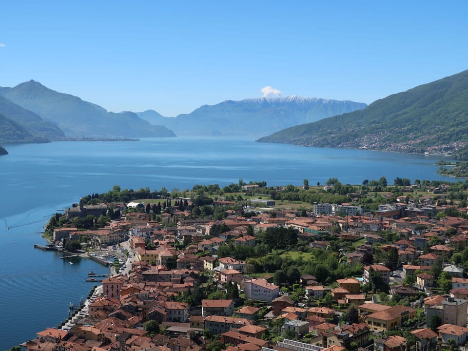 Water, Sky, Mountain, Building, Azure, Tree, Natural Landscape, Plant, Coastal And Oceanic Landforms, Lake