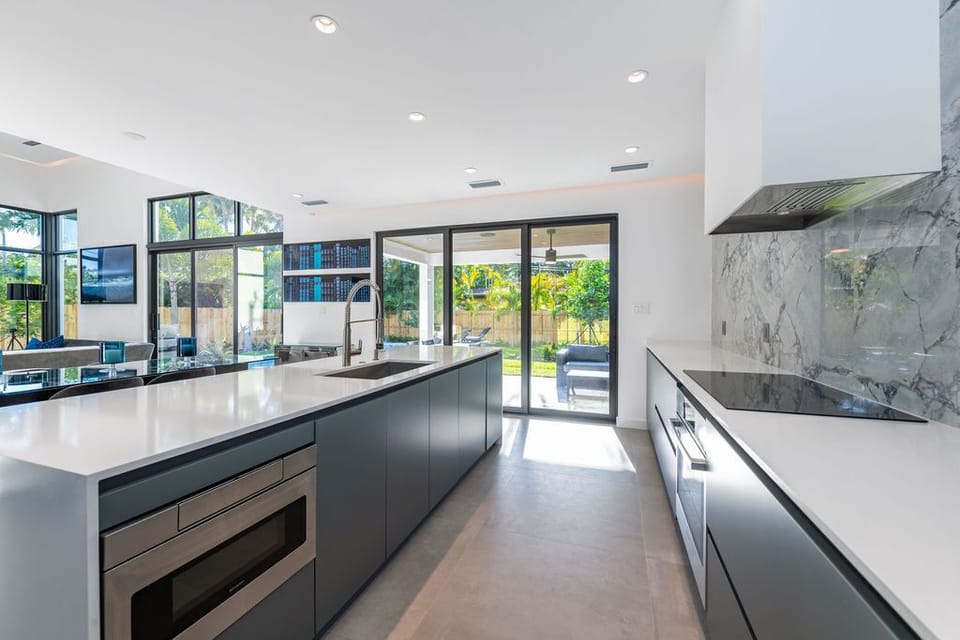 Kitchen looks onto stunning backyard