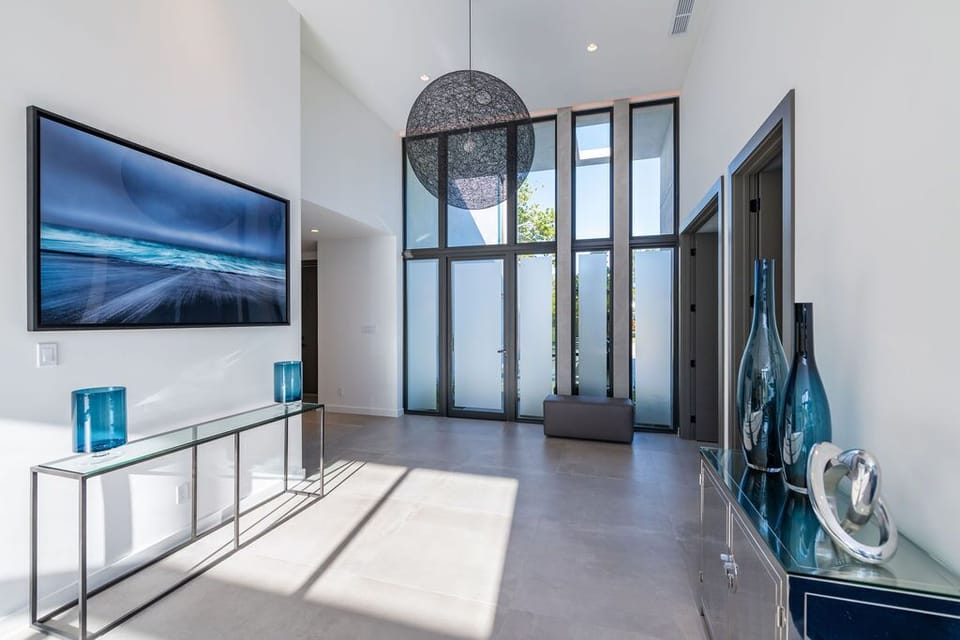 Stunning and bright front entrance area with 14 foot ceilings