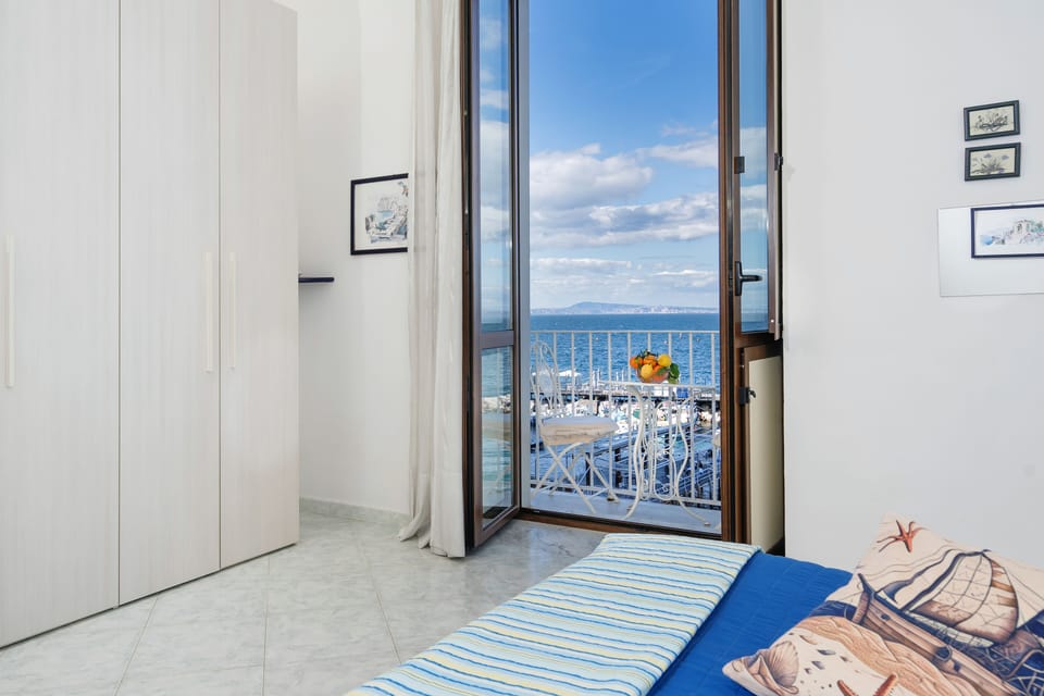 Apartment, 1 Bedroom, Sea View | 1 bedroom, bed sheets