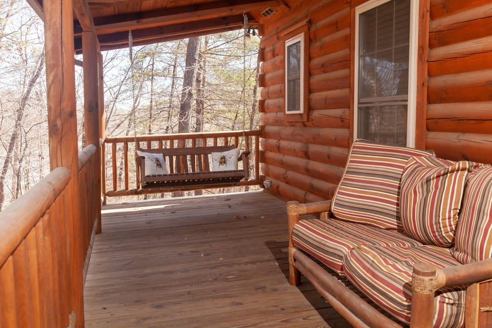 The fron porch has a swing and a comfy loveseat to sit and enjoy the mountains.