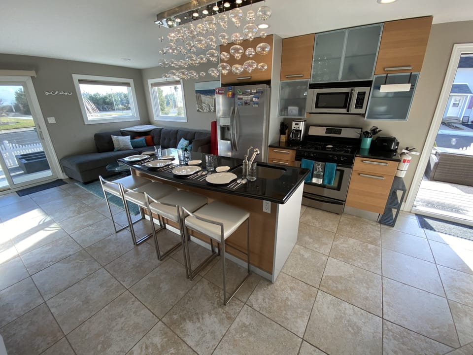 Wide open kitchen family / entertainment area. Many windows for natural sunlight