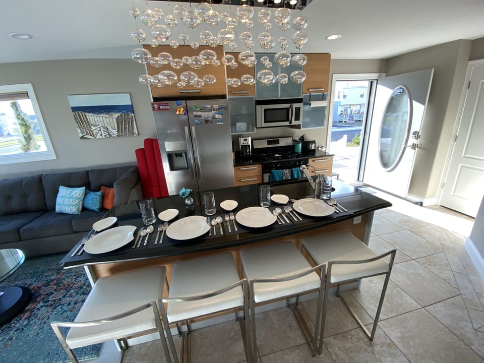 Fully Stocked w/ dishes, cutlery, barware, blender, coffee pot, toaster, spices.