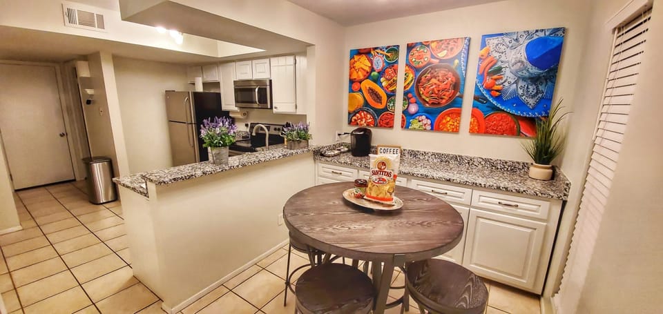 The breakfast nook & coffee bar offers seating for four, & storage