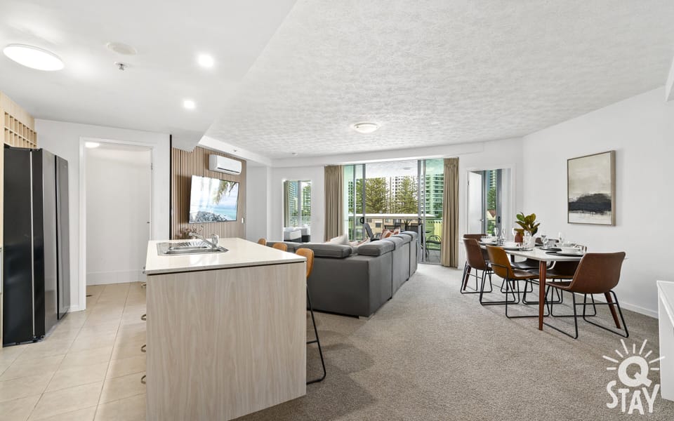Living area is right next to the dining area, the kitchen and the balcony