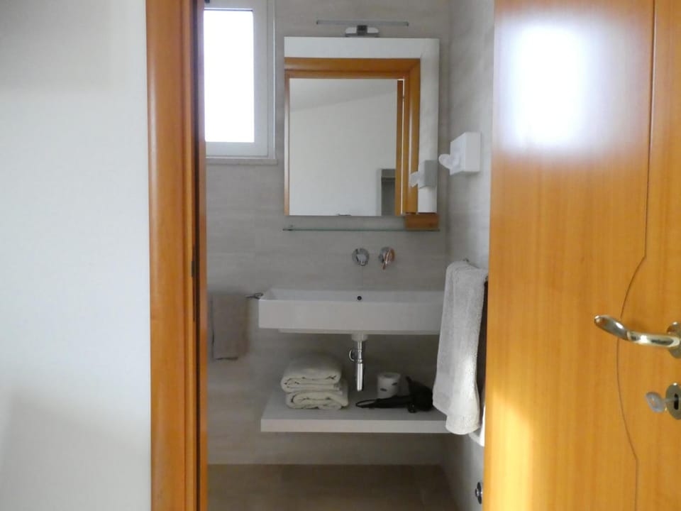 Standard Double Room, Balcony, Garden View | Bathroom | Shower, rainfall showerhead, free toiletries, hair dryer