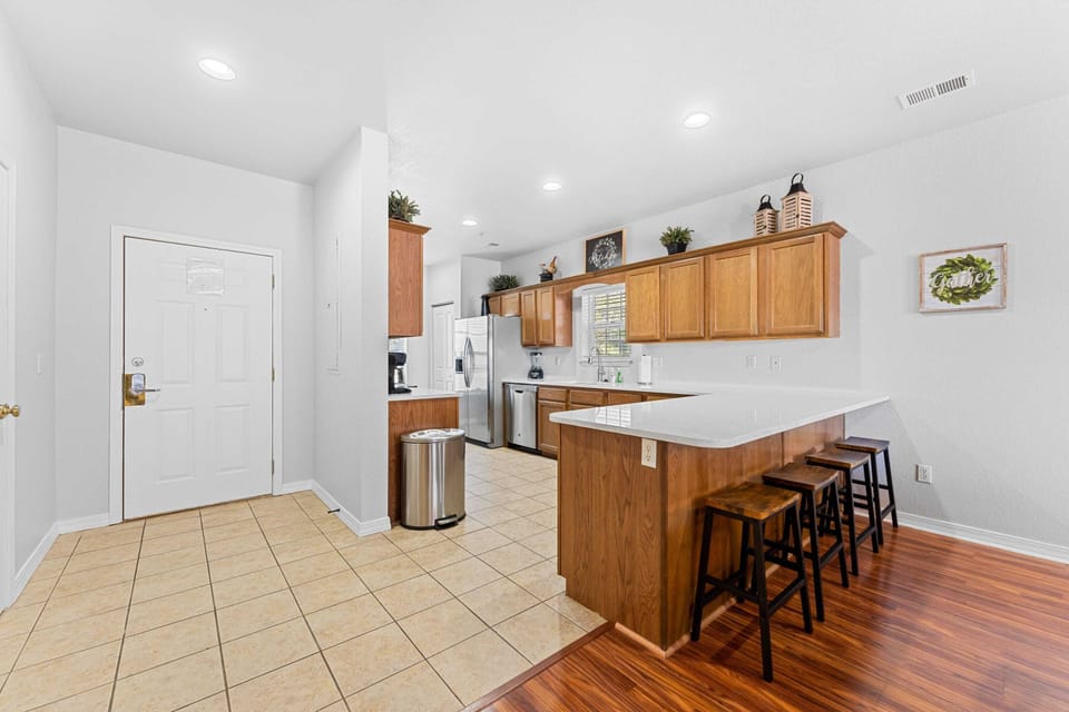 Kitchen island offers extra seating for Dining.