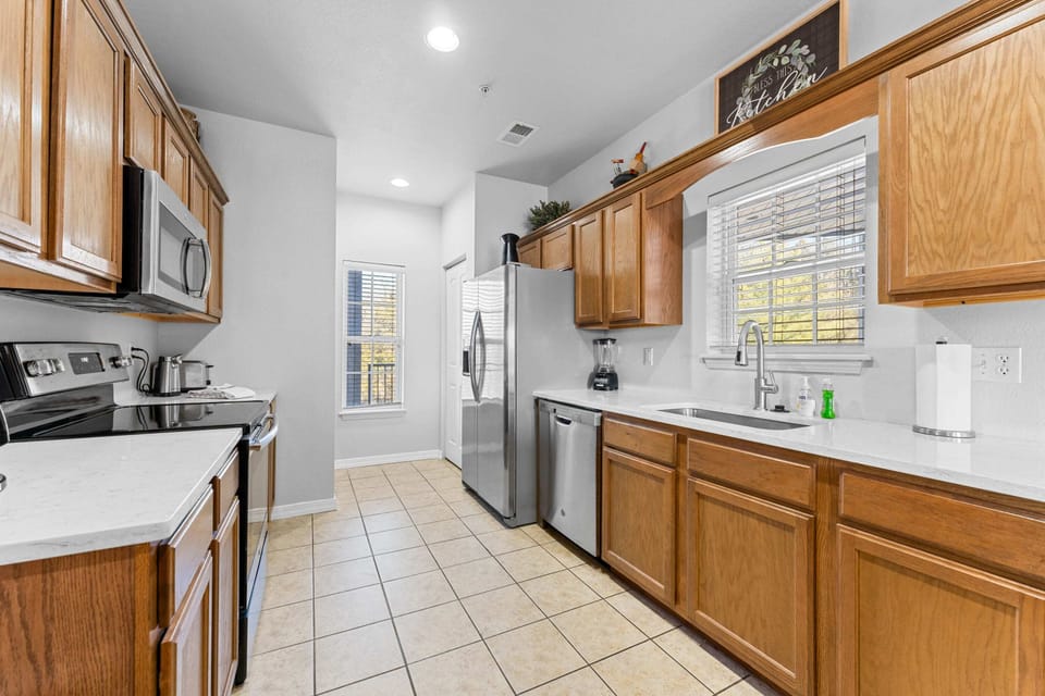 Large windows provide a bright kitchen.