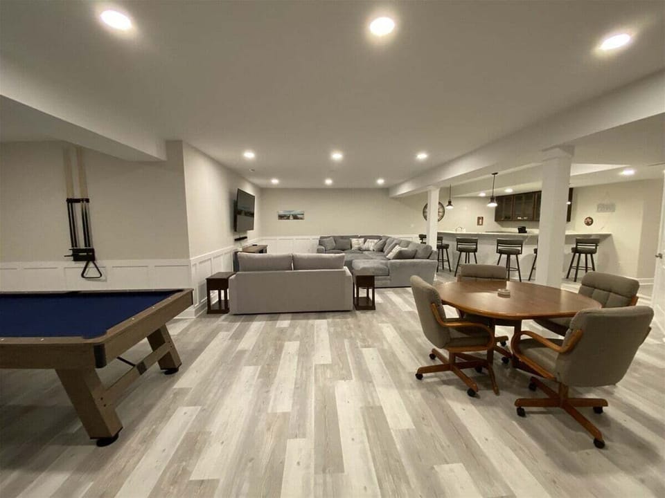 Incredible Newly Finished Basement Entertainment Room Including Wet Bar, Pool Table, Foosball, Air Hockey, Ping Pong, Huge TV, Jukebox & arcade!