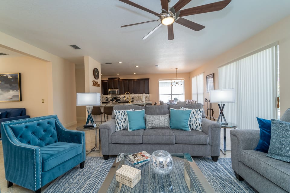 Family seating area showing patio doors to pool area