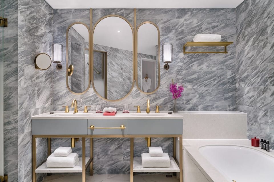 Corner Suite with Suite Privilege | Bathroom | Separate tub and shower, free toiletries, hair dryer, bathrobes