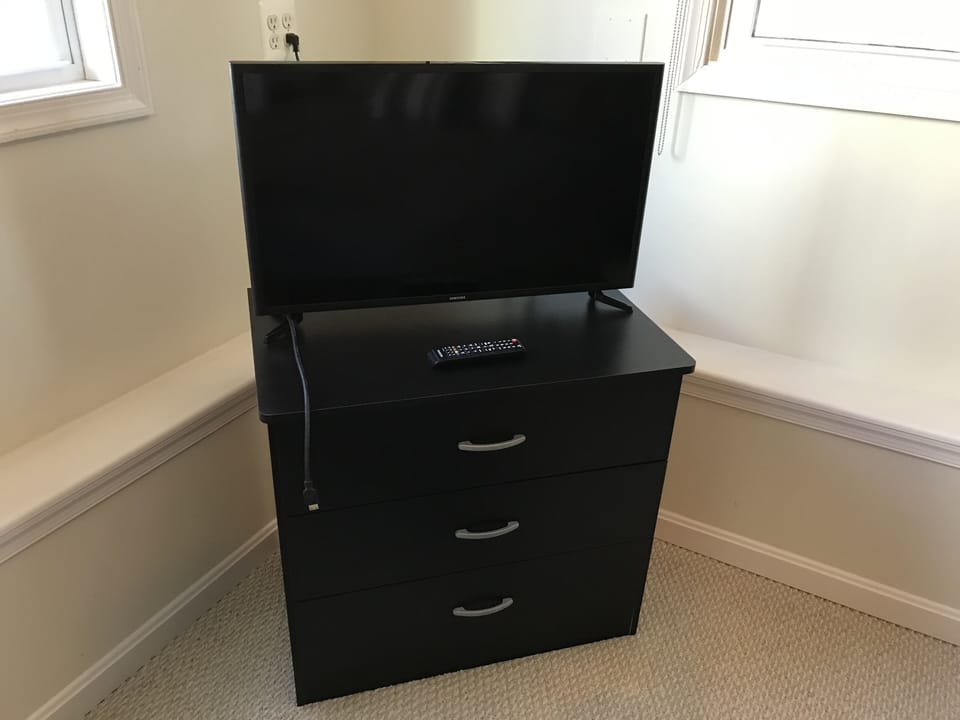 Bedroom TV with dresser. Has cable TV and HDMI cable. 